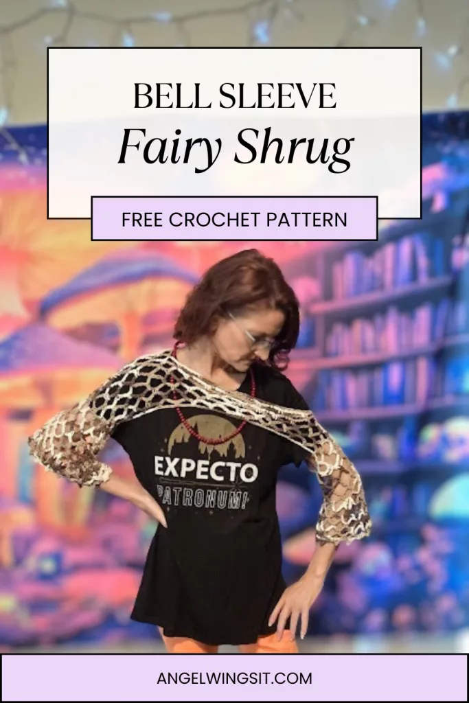 Person wearing a crocheted Bell Sleeve Fairy Shrug over a black “Expecto Patronum” shirt and orange shorts, standing in front of a bookshelf—showcasing the shrug’s net-like texture and relaxed fit.