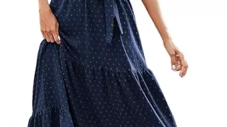 A deep‑navy, Swiss‑dot maxi with a soft wrap silhouette and flutter sleeves. Elegant, floaty, and full of that quiet, starlit Night Court energy.